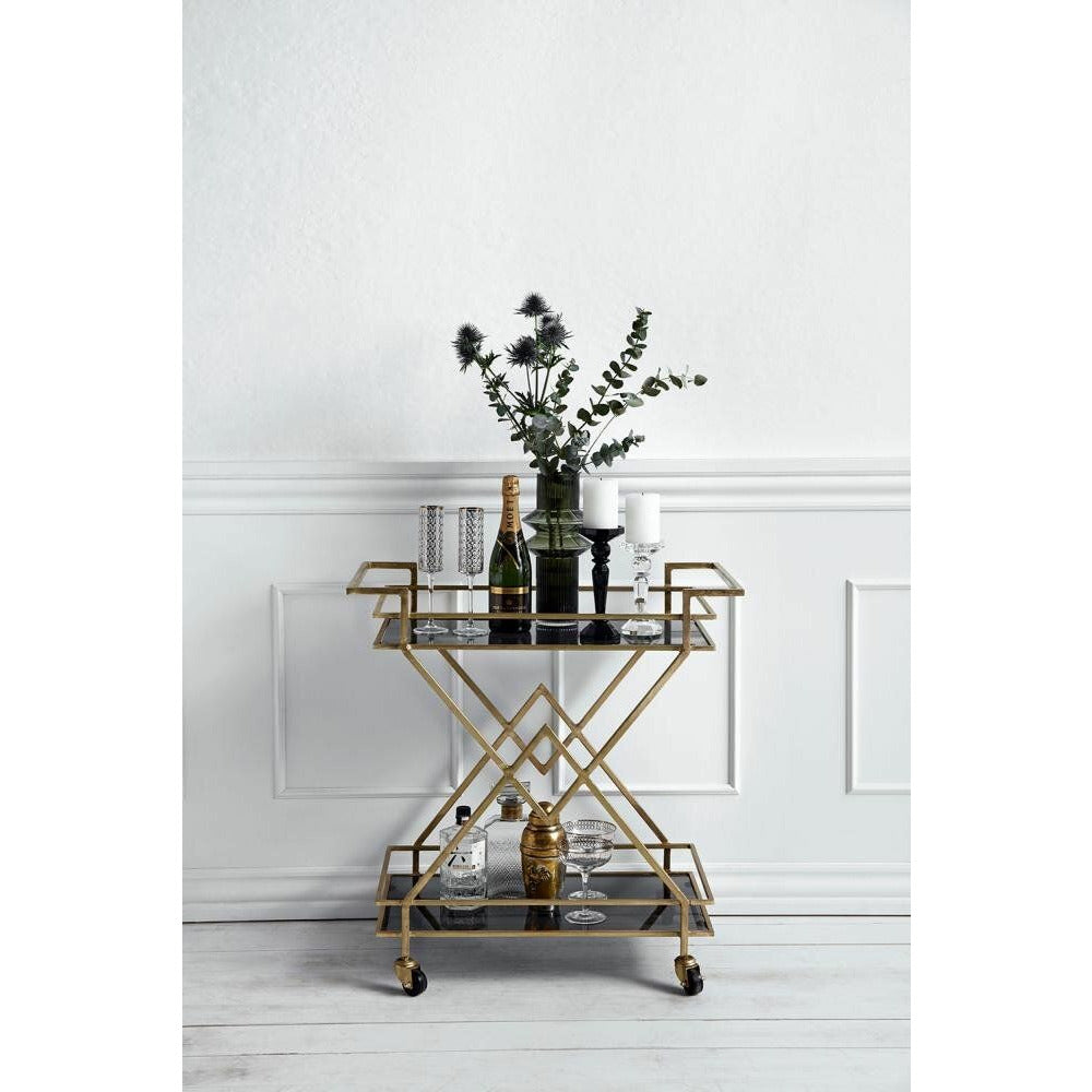 Mesa de rolos Nordal TROLLEY em ferro - 44x76 cm - ouro/preto de vidro